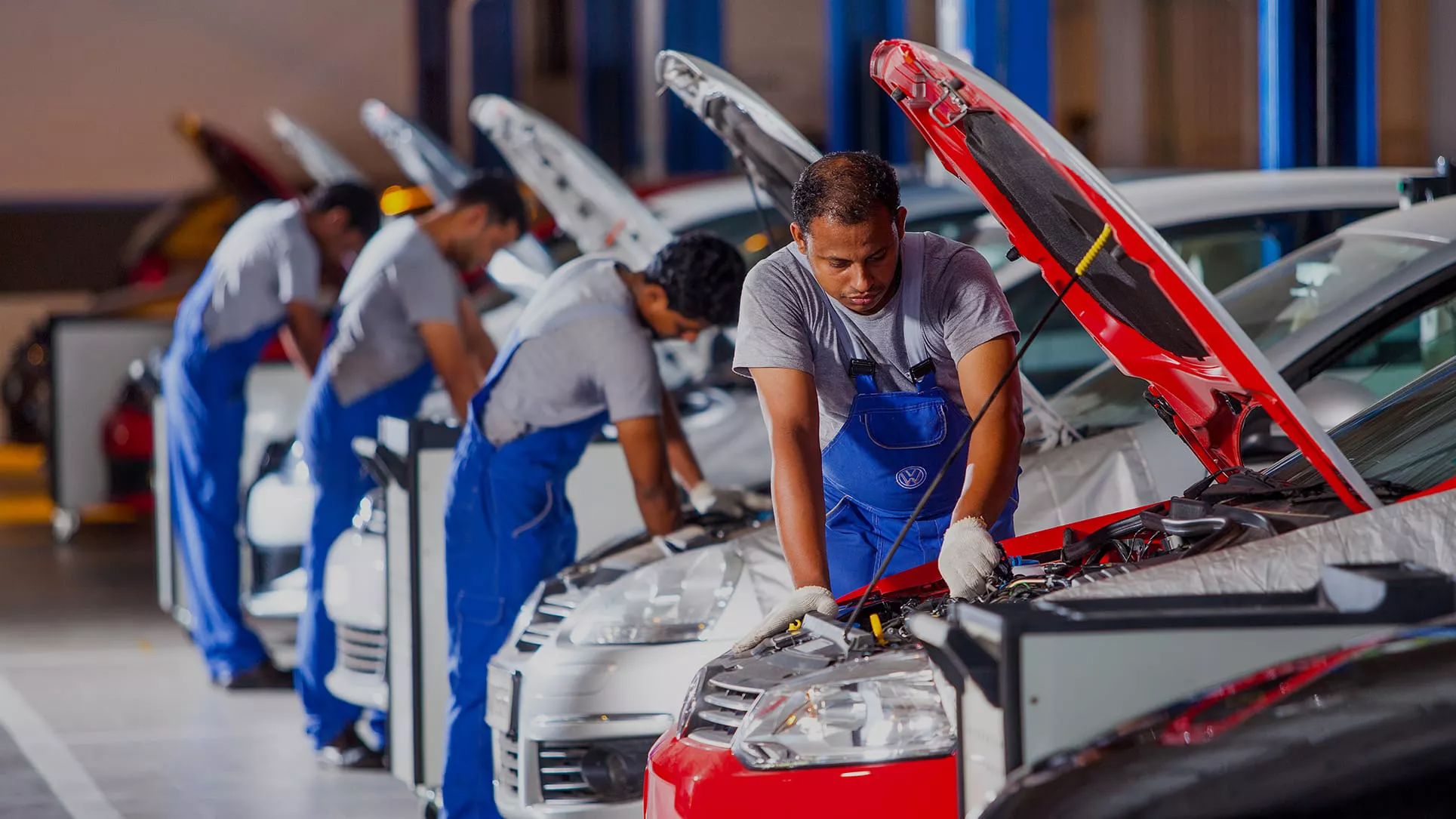 Automotive mechanic working under a car